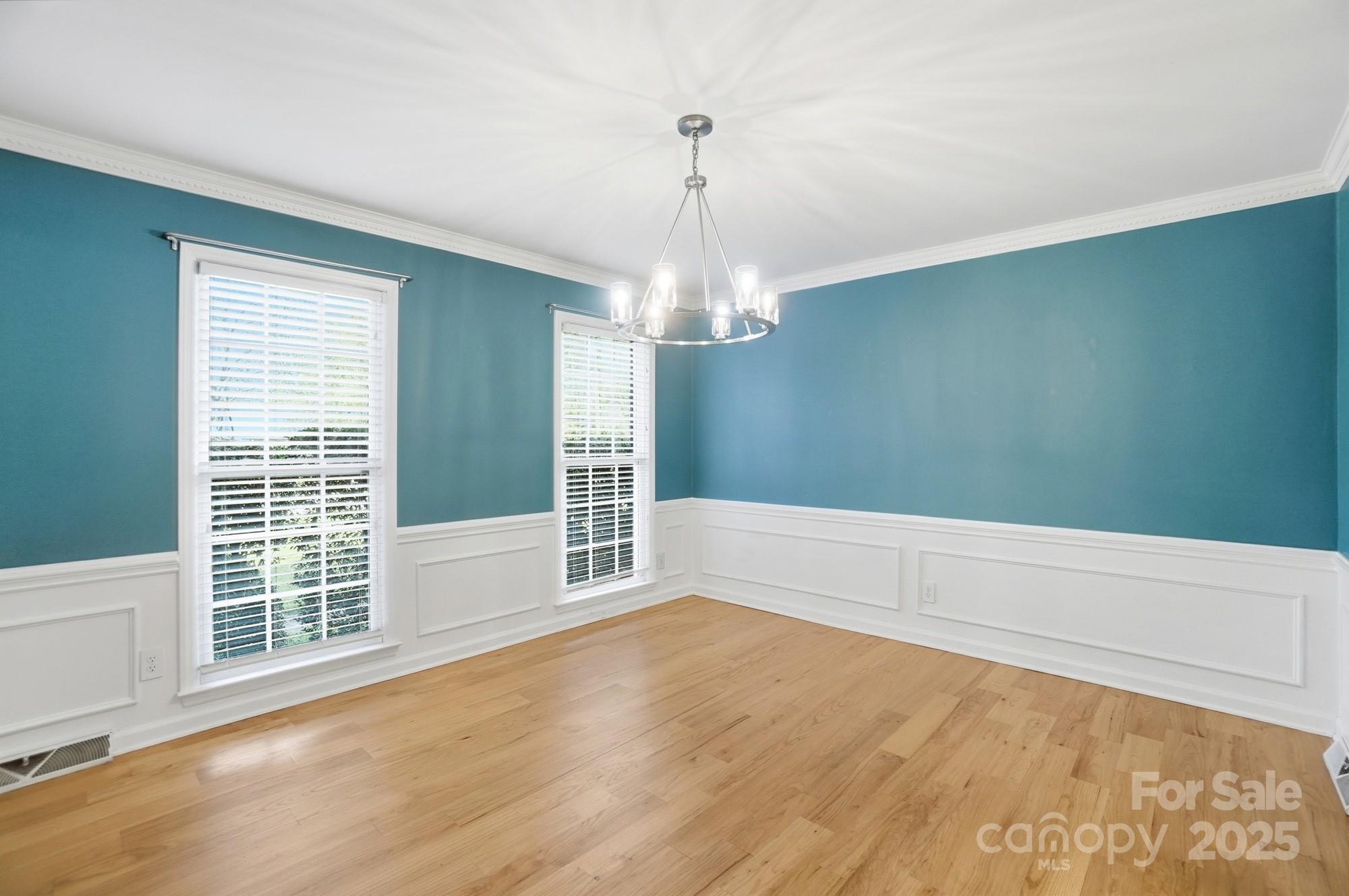 1308 Dumbarton Road Gastonia, NC 28054 - Photo 13 of 48 a view of wooden floor and windows in a room