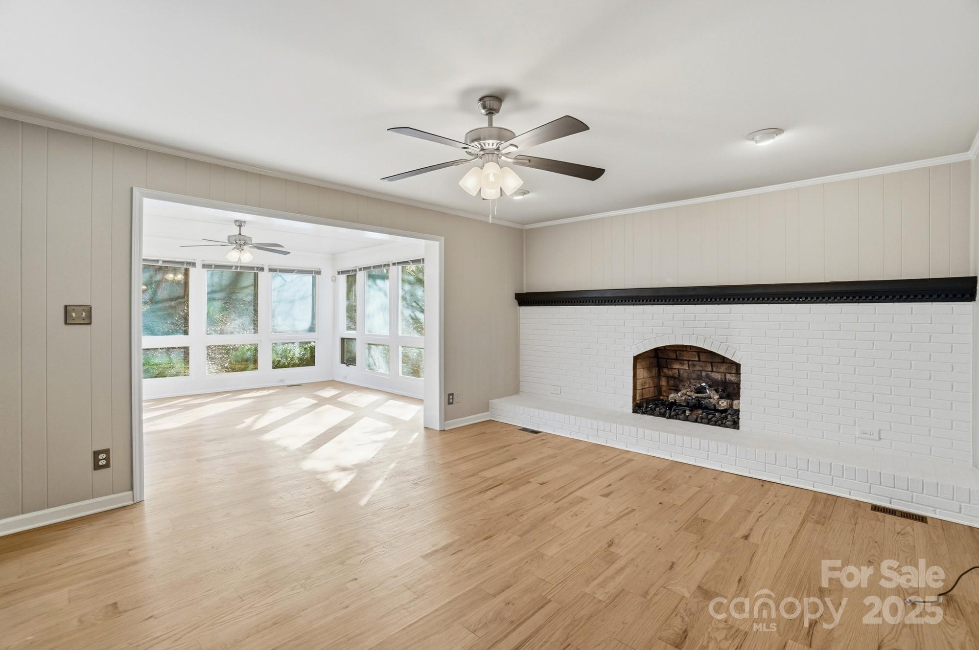 1308 Dumbarton Road Gastonia, NC 28054 - Photo 26 of 48 a view of an empty room with a window and a kitchen