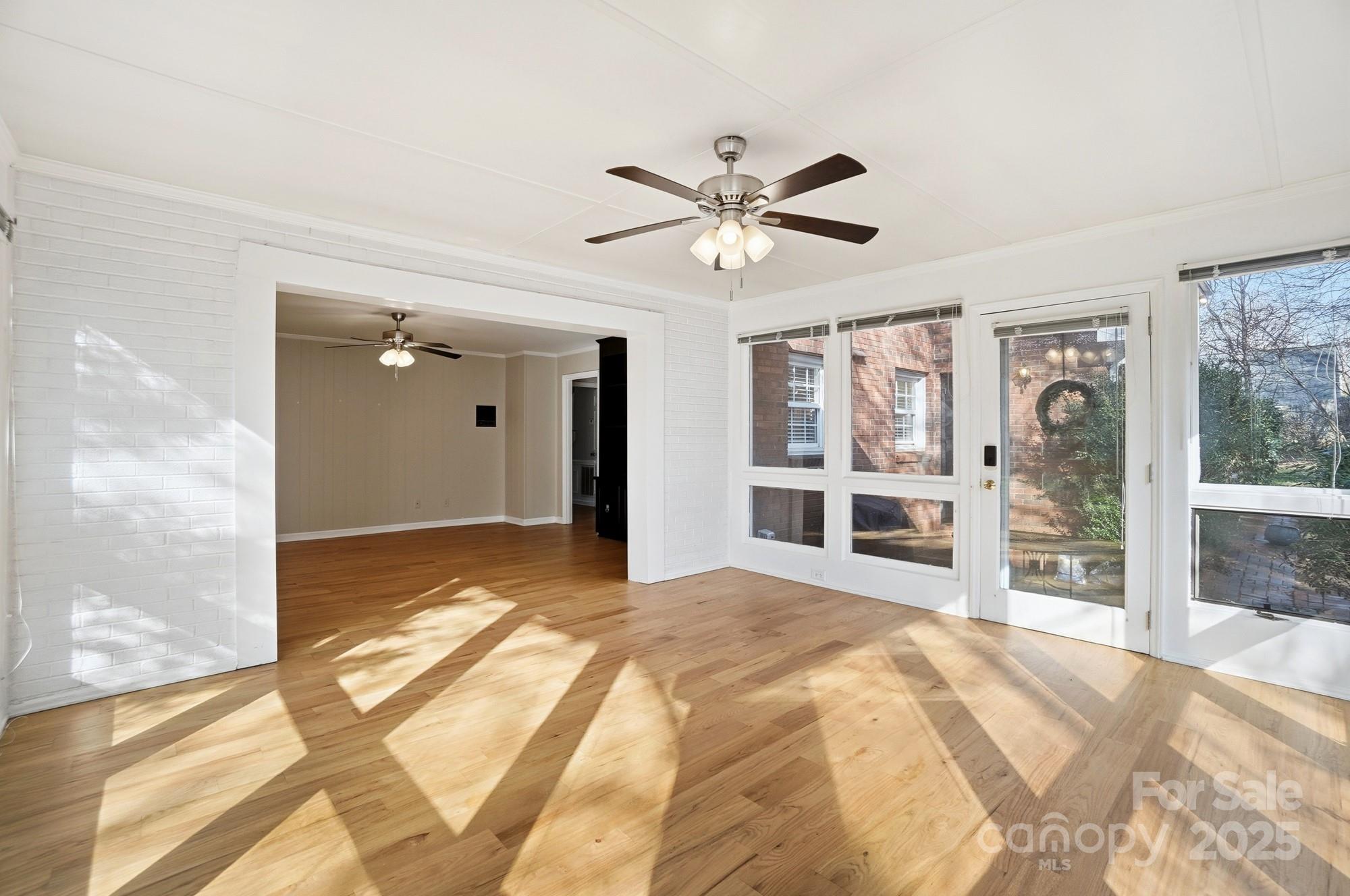1308 Dumbarton Road Gastonia, NC 28054 - Photo 31 of 48 a spacious bedroom with a large bed and a chandelier