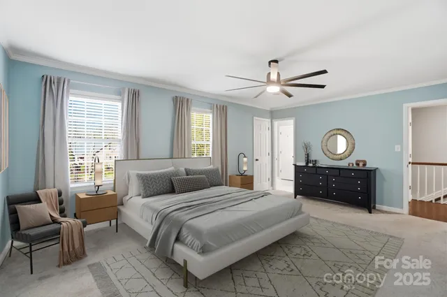 a bedroom with a large bed and a window