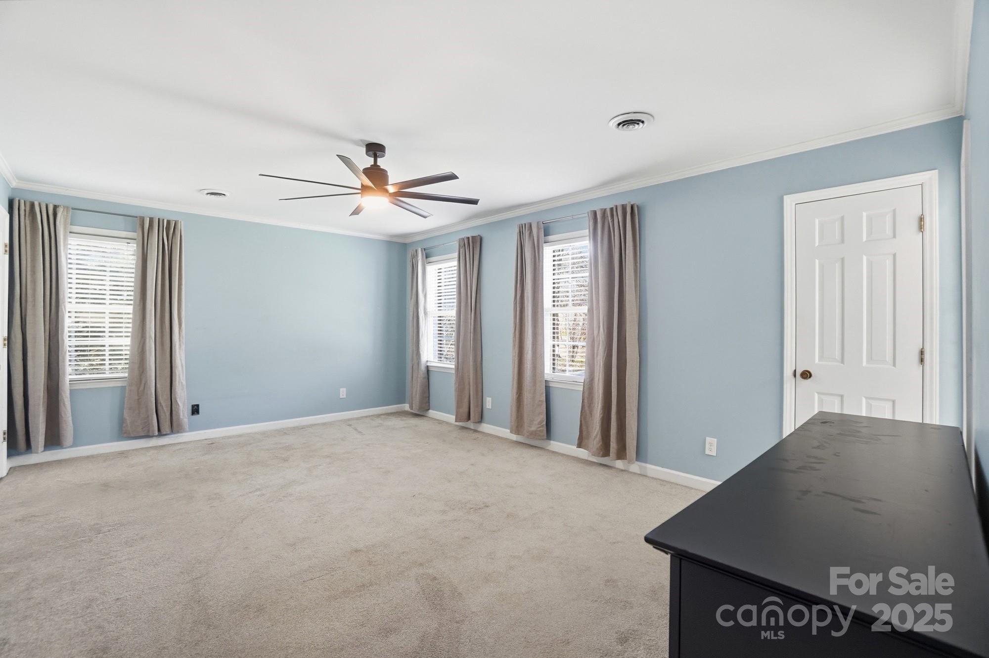1308 Dumbarton Road Gastonia, NC 28054 - Photo 33 of 48 a view of a livingroom with a ceiling fan and window