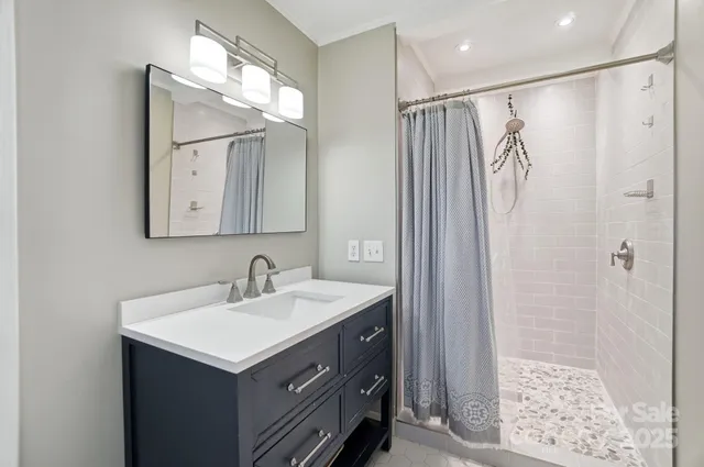 a bathroom with a sink double vanity and a mirror