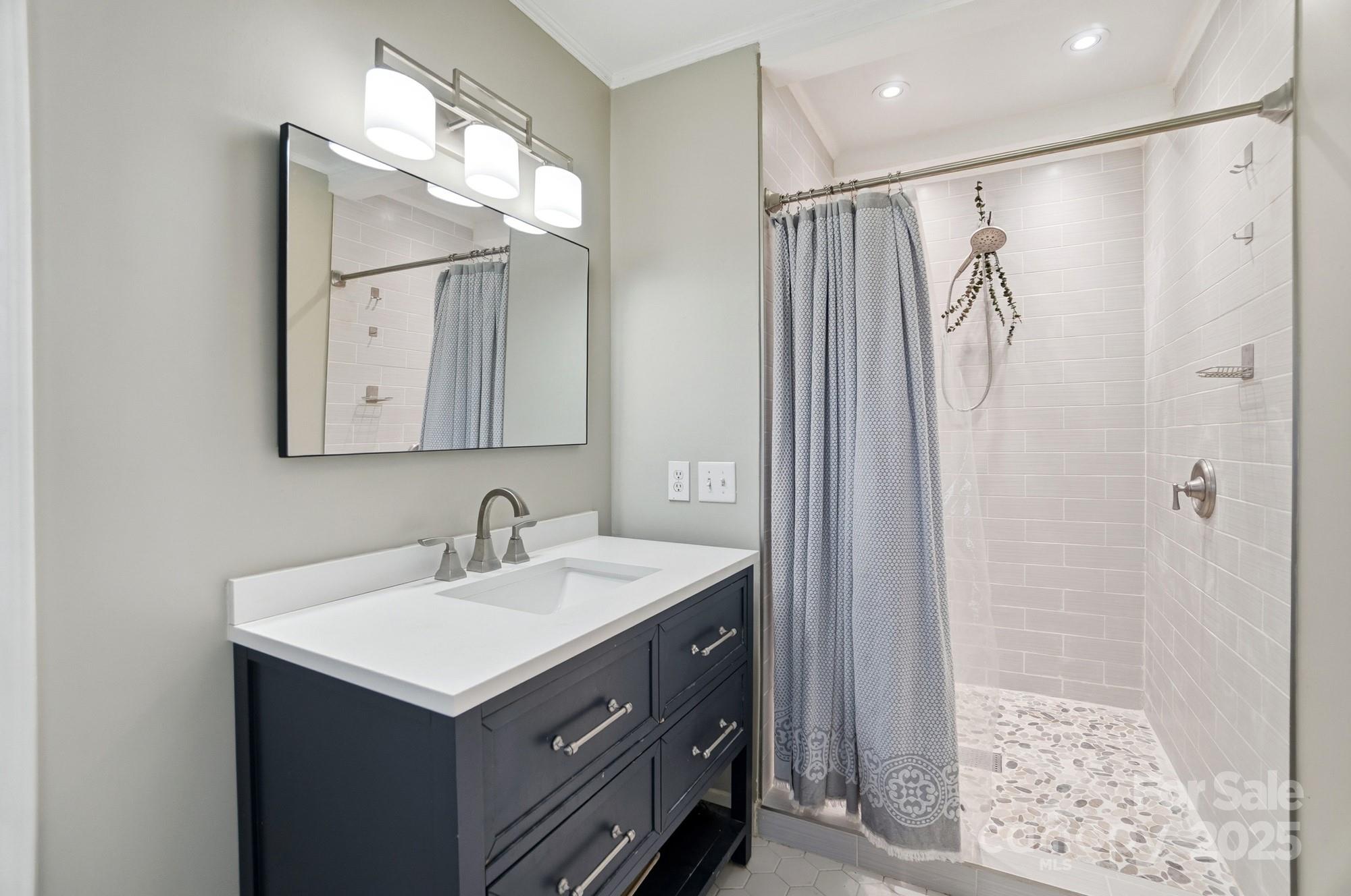 1308 Dumbarton Road Gastonia, NC 28054 - Photo 34 of 48 a bathroom with a sink double vanity and a mirror