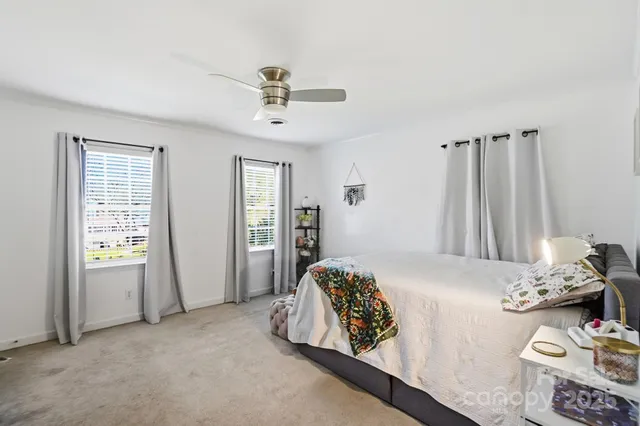 a bedroom with furniture and a window