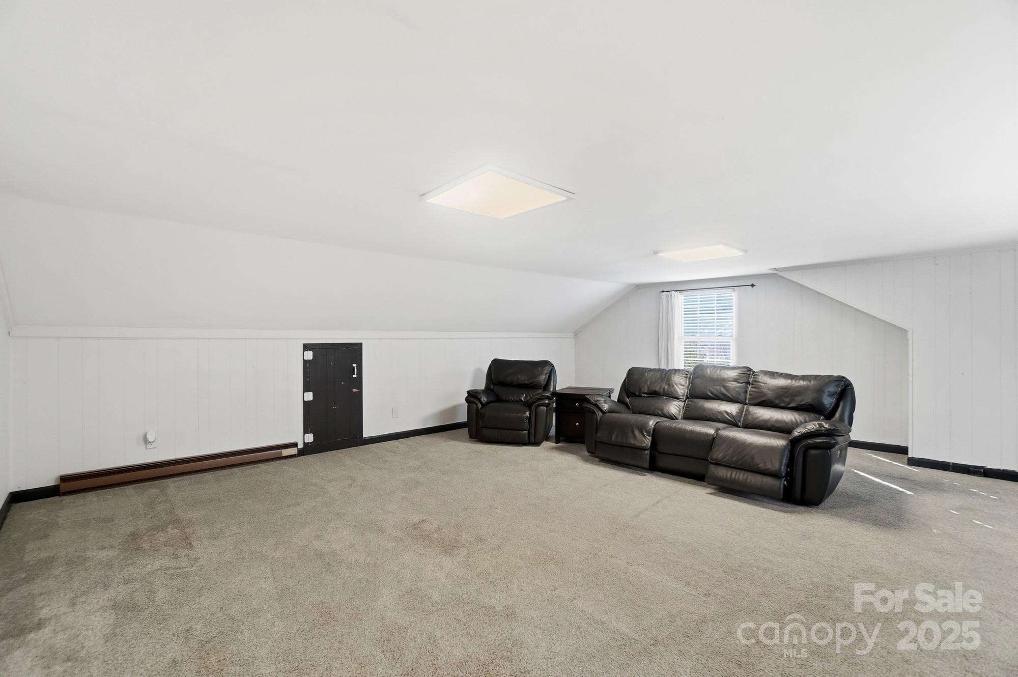 1308 Dumbarton Road Gastonia, NC 28054 - Photo 44 of 48 a living room with furniture and a couch