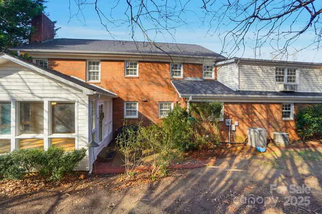 a view of a brick house with a large windows