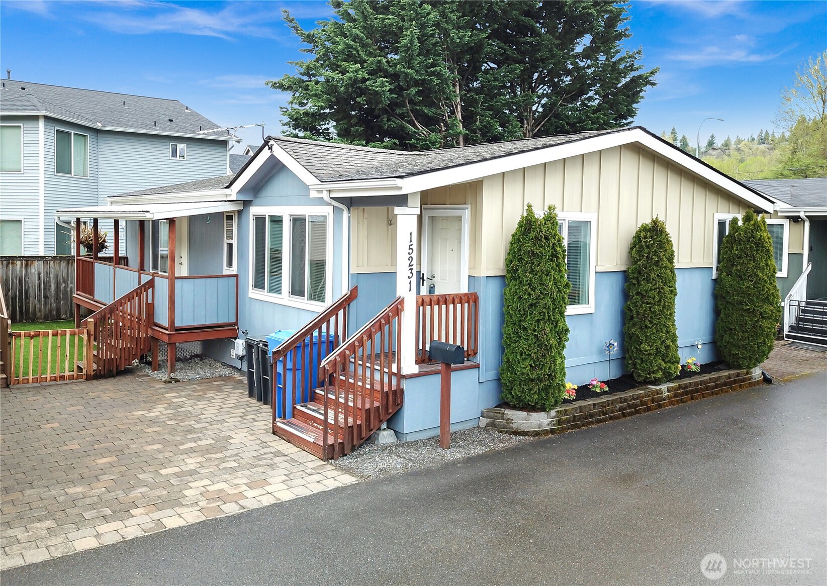 15231 Pine Drive Renton, WA 98058 - Photo 1 of 29 a view of a house with wooden walls and roof