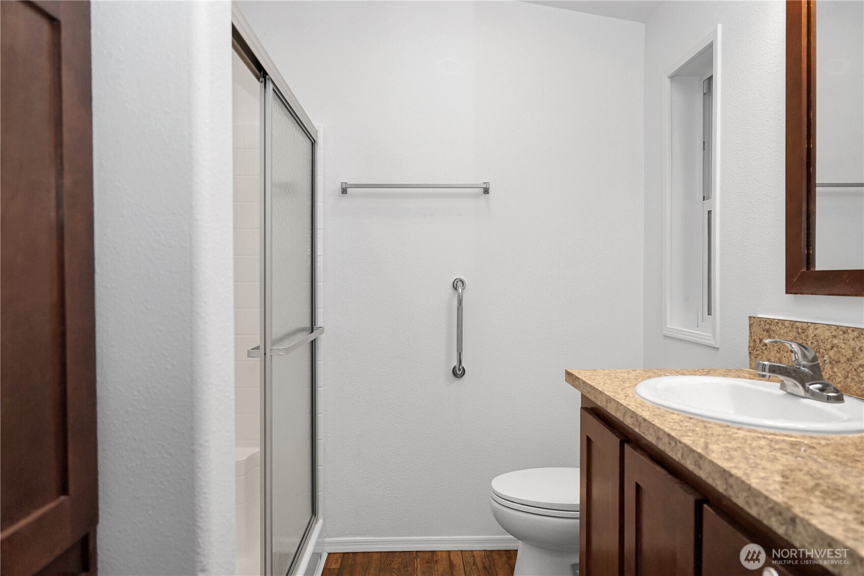 15231 Pine Drive Renton, WA 98058 - Photo 18 of 29 a bathroom with a granite countertop sink toilet and a mirror