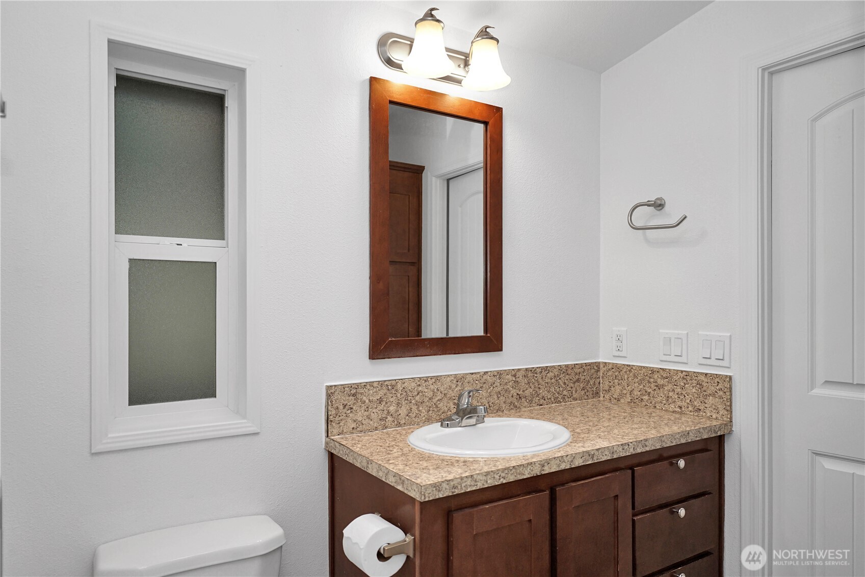 15231 Pine Drive Renton, WA 98058 - Photo 19 of 29 a bathroom with a toilet sink and mirror