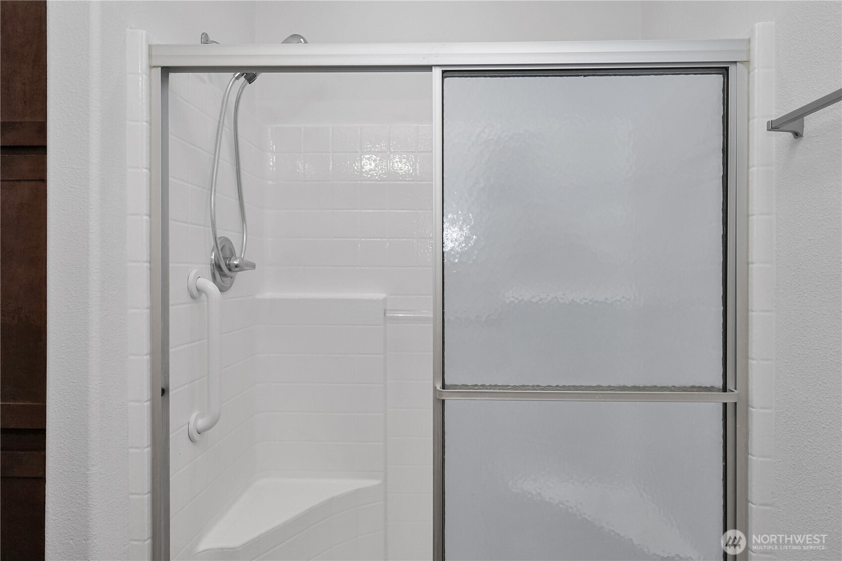 15231 Pine Drive Renton, WA 98058 - Photo 20 of 29 a bathroom with a glass shower door