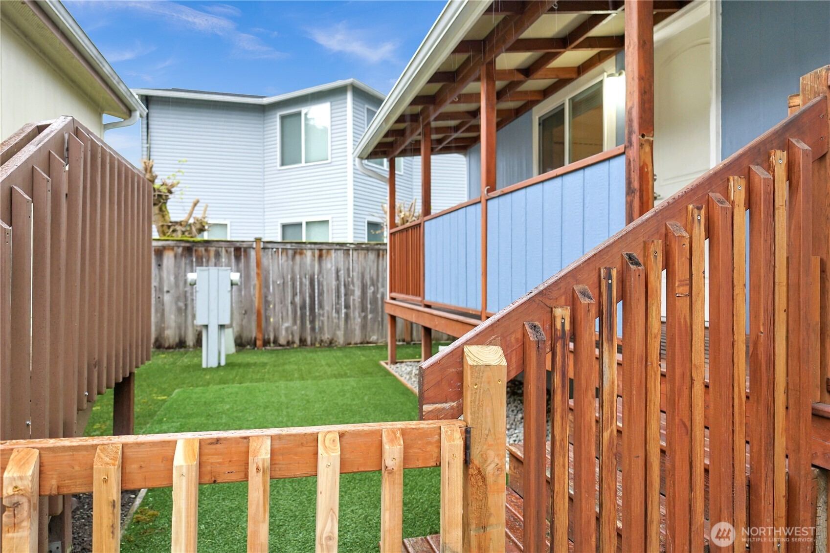 15231 Pine Drive Renton, WA 98058 - Photo 2 of 29 a view of a house with wooden fence