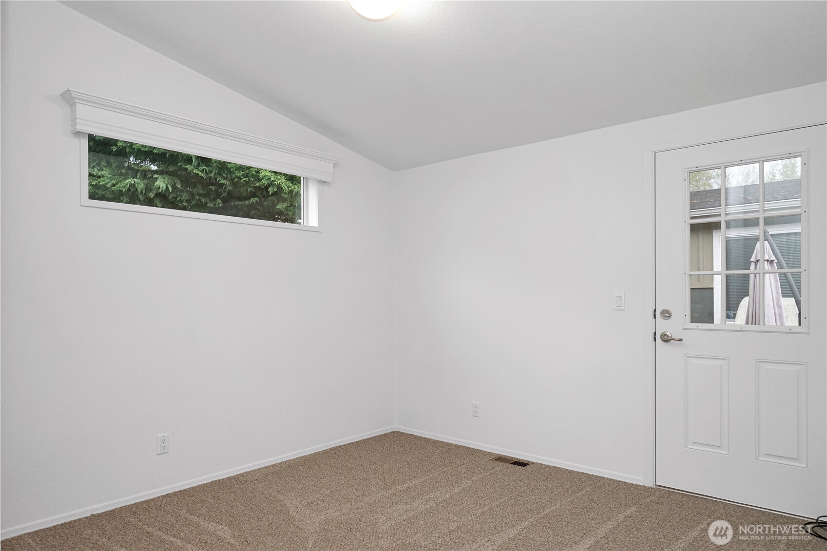 15231 Pine Drive Renton, WA 98058 - Photo 23 of 29 a view of a small space with wooden floor and a window