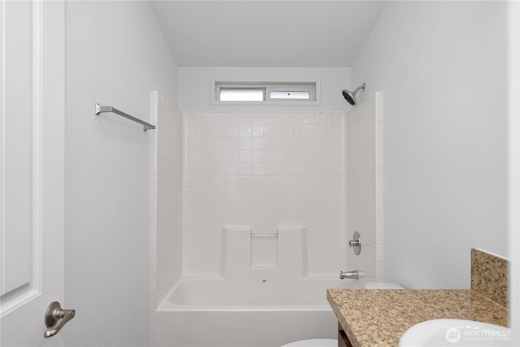 15231 Pine Drive Renton, WA 98058 - Photo 27 of 29 a bathroom with a granite countertop tub shower and a sink