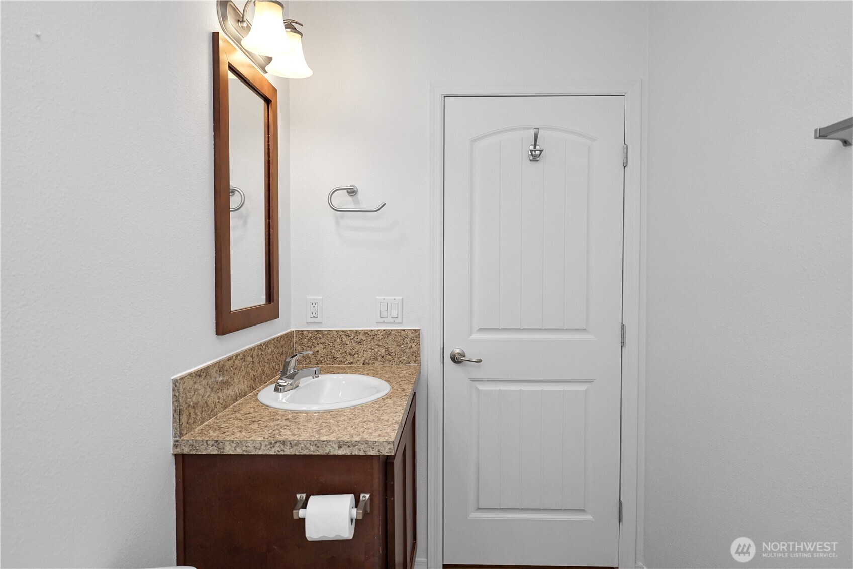 15231 Pine Drive Renton, WA 98058 - Photo 28 of 29 a bathroom with a granite countertop sink and a mirror