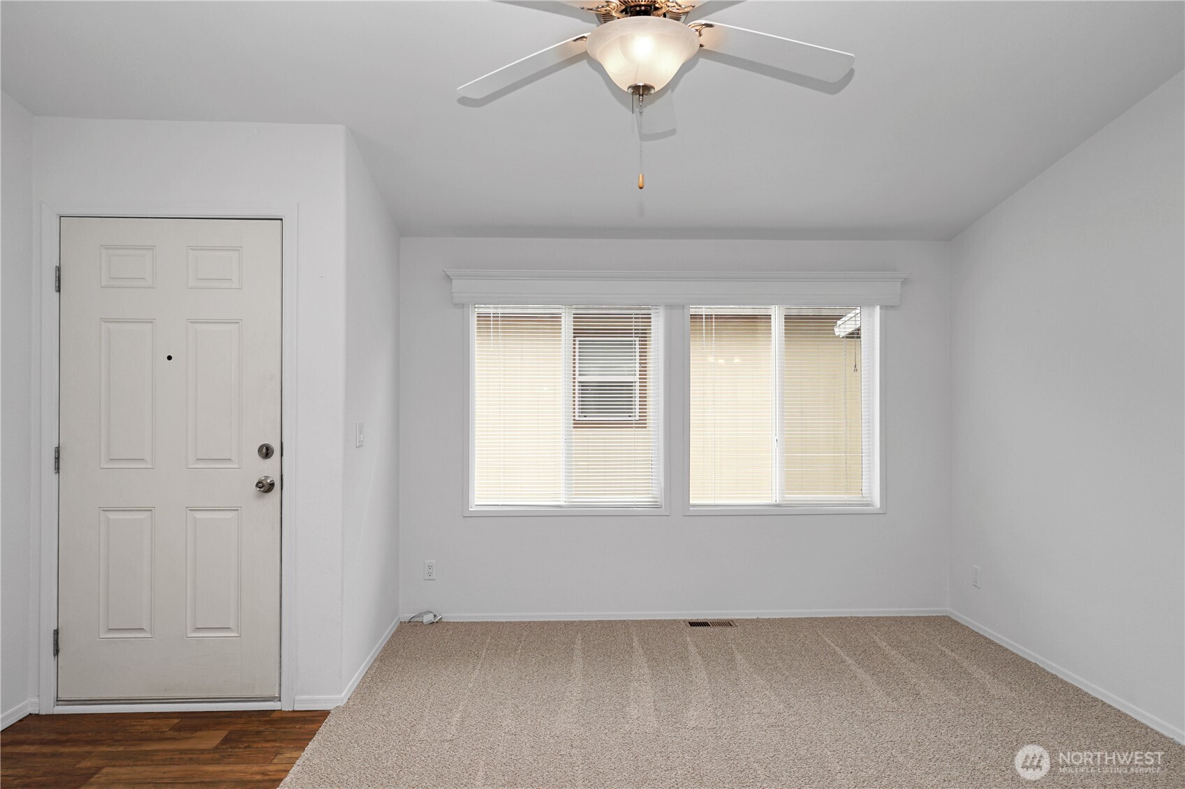 15231 Pine Drive Renton, WA 98058 - Photo 4 of 29 a view of an empty room with a window