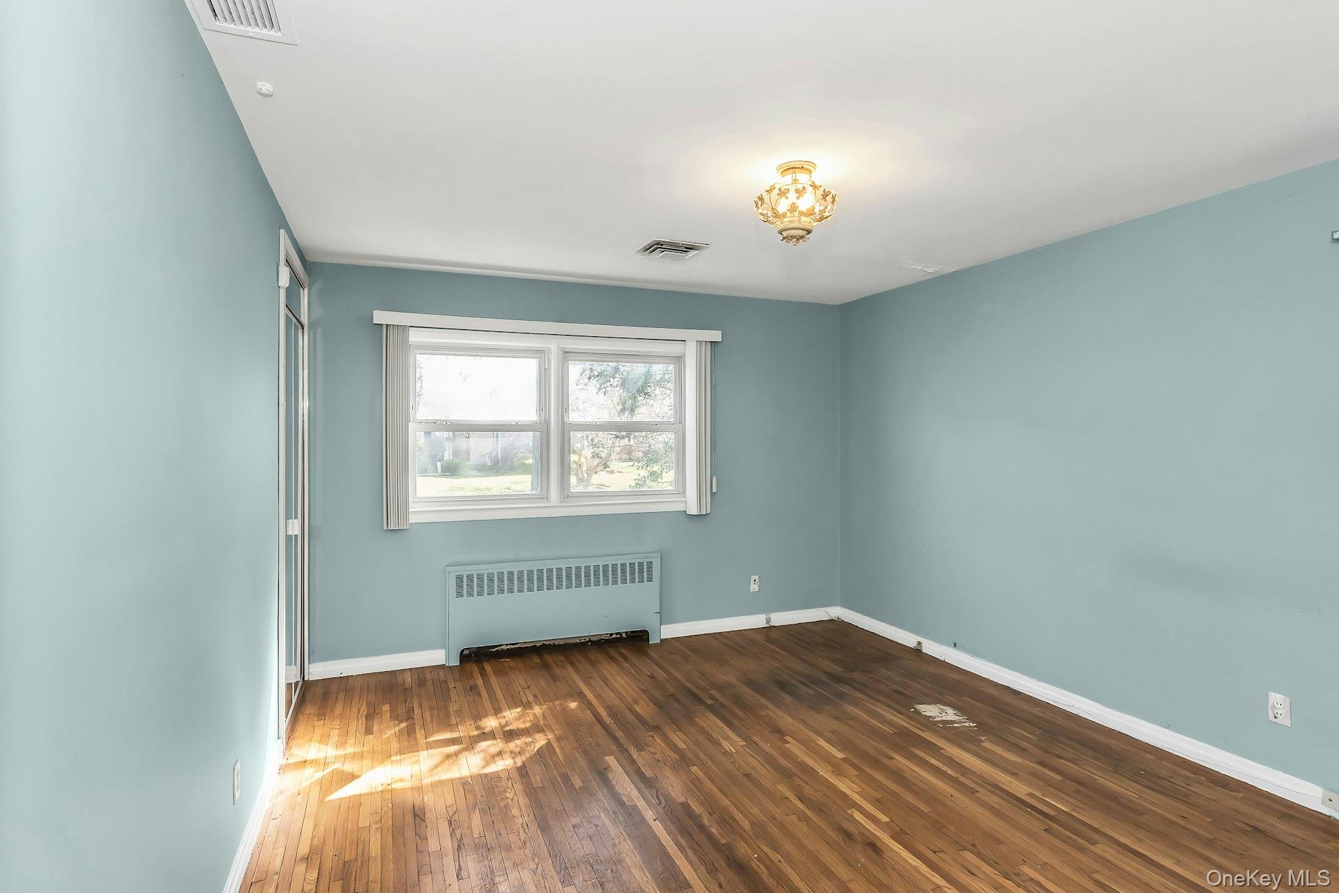 11 Rockhill Road East Hills, NY 11577 - Photo 16 of 27 an empty room with a window