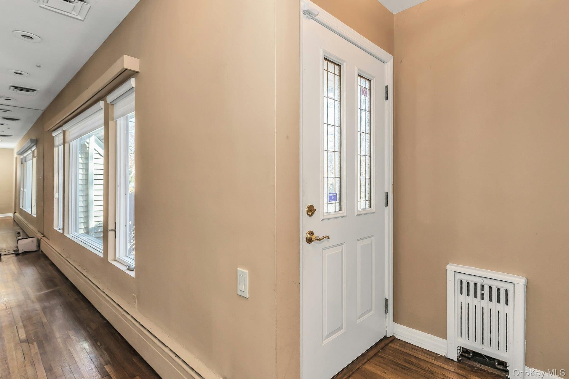 11 Rockhill Road East Hills, NY 11577 - Photo 3 of 27 a view of a hallway with wooden floor and staircase