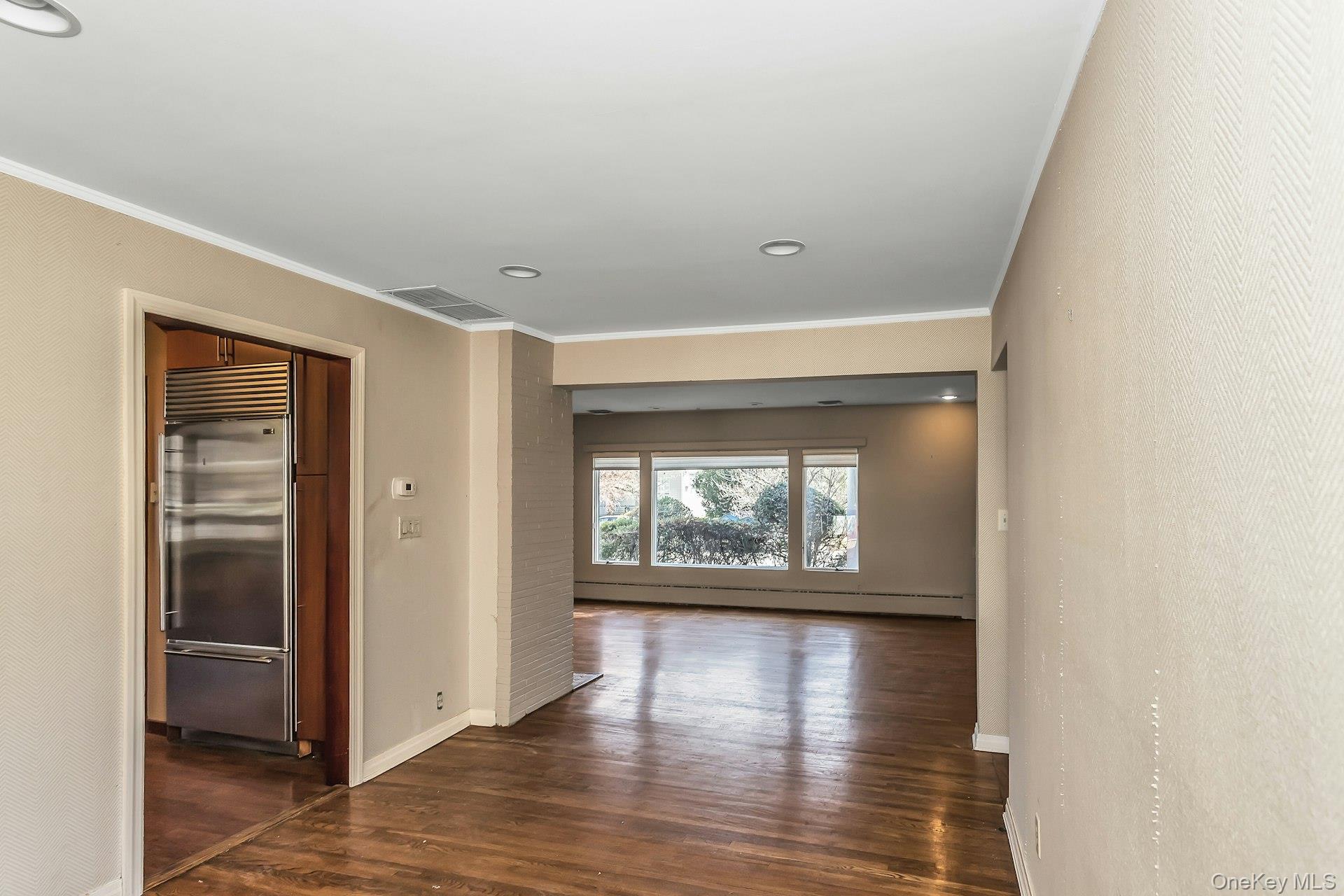 11 Rockhill Road East Hills, NY 11577 - Photo 8 of 27 a view of an empty room with wooden floor and a window