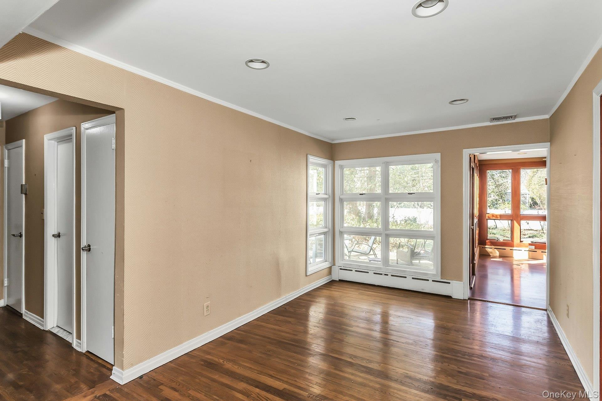 11 Rockhill Road East Hills, NY 11577 - Photo 9 of 27 wooden floor in an empty room with a window