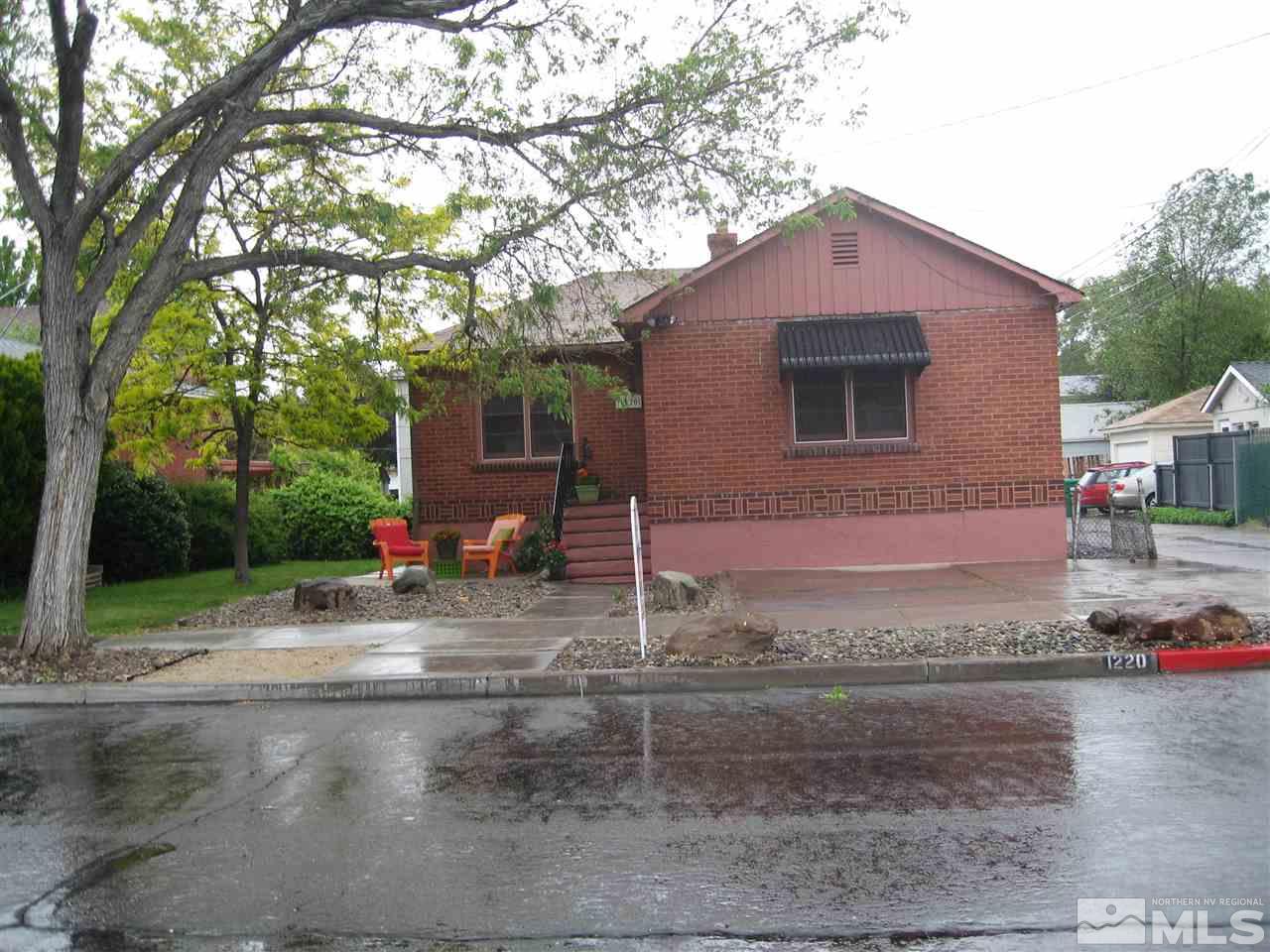 1220 Forest Street Reno, NV 89509 - Photo 25 of 25 a front view of a house with a yard and garage