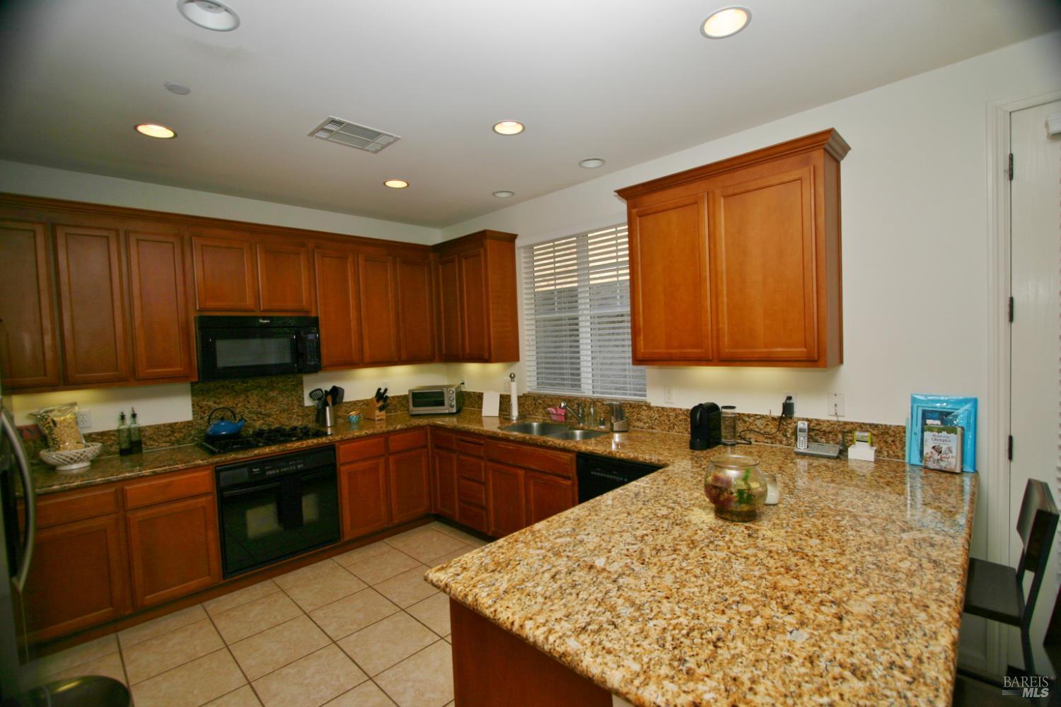36 Rowe Ranch Drive Novato, CA 94949 - Photo 2 of 12 a kitchen with a sink stove and cabinets