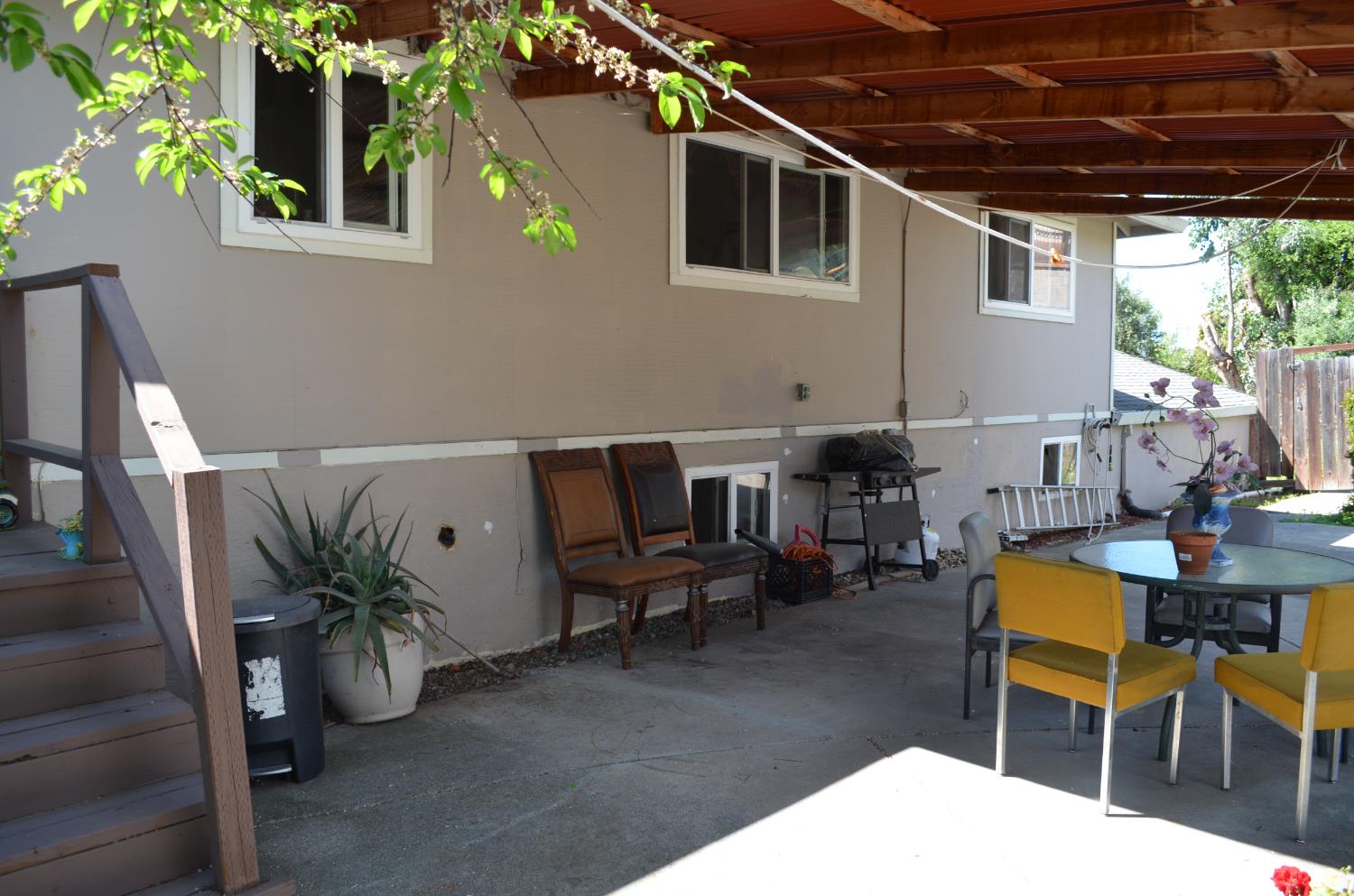 208 Appian Way Union City, CA 94587 - Photo 13 of 38 a view of a patio with table and chairs potted plants with wooden fence