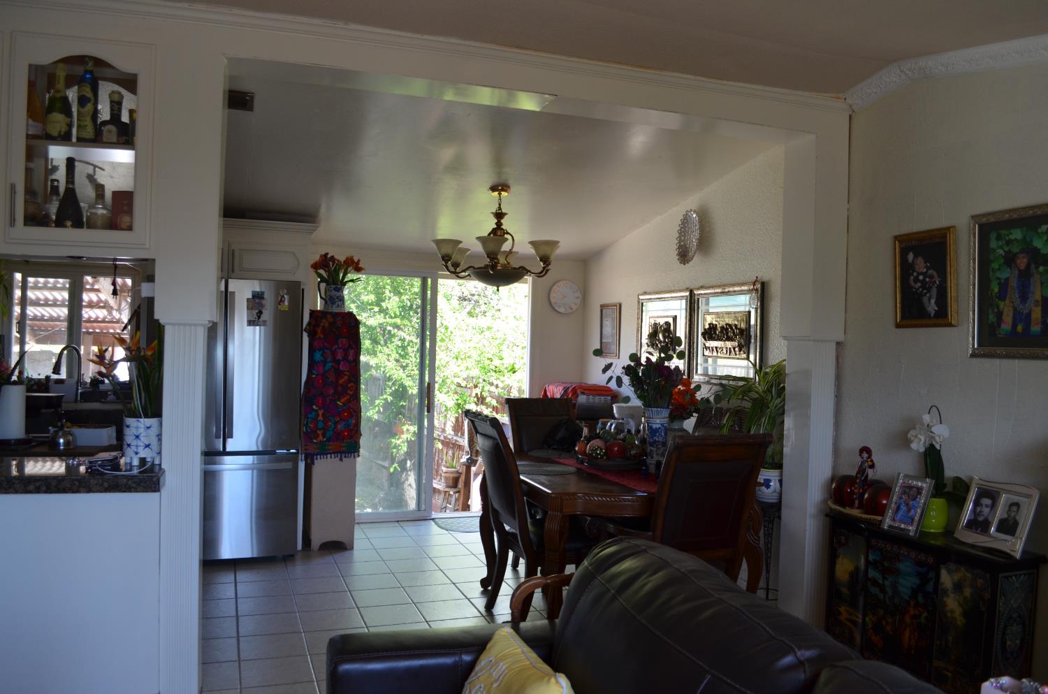 208 Appian Way Union City, CA 94587 - Photo 19 of 38 a kitchen with stainless steel appliances granite countertop a refrigerator dining table and chairs