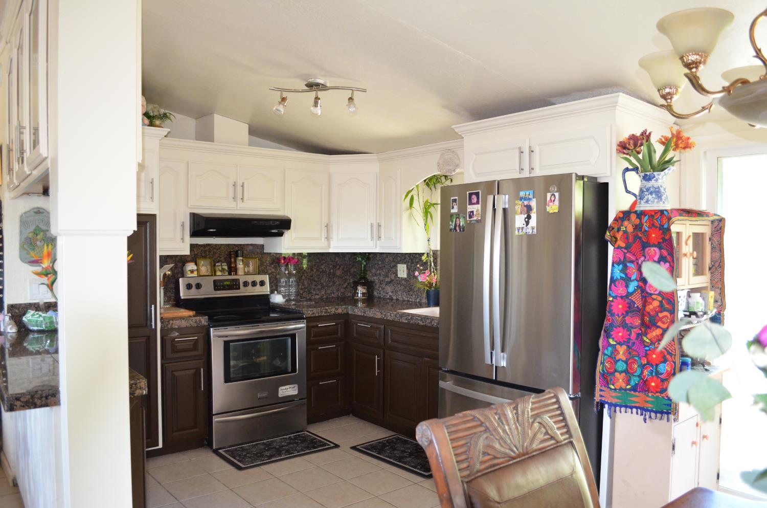 208 Appian Way Union City, CA 94587 - Photo 21 of 38 a kitchen with stainless steel appliances kitchen island granite countertop a refrigerator and a stove top oven