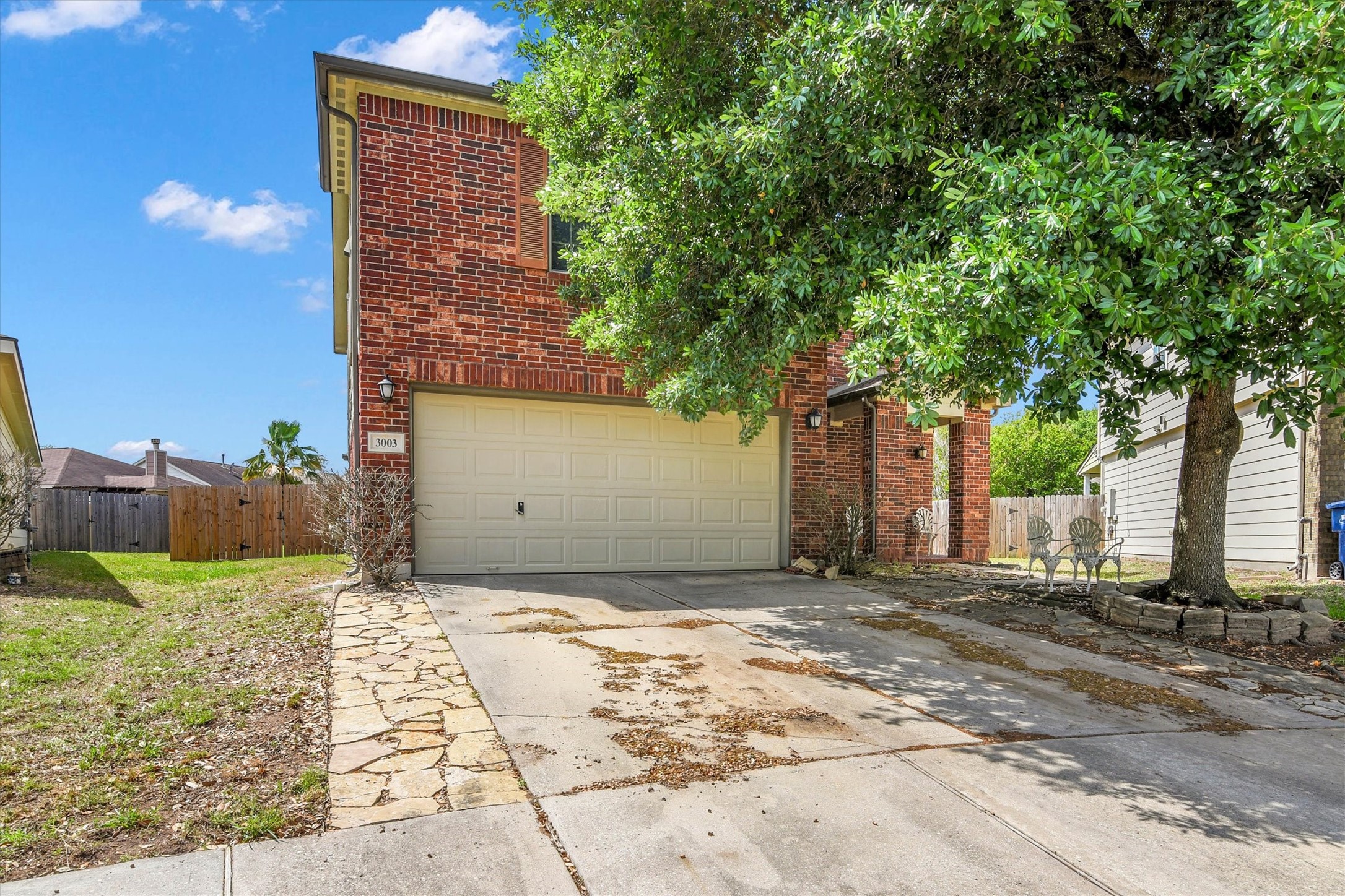 3003 Legends York Drive Spring, TX 77386 - Photo 3 of 29 a view of a house with a yard and large tree