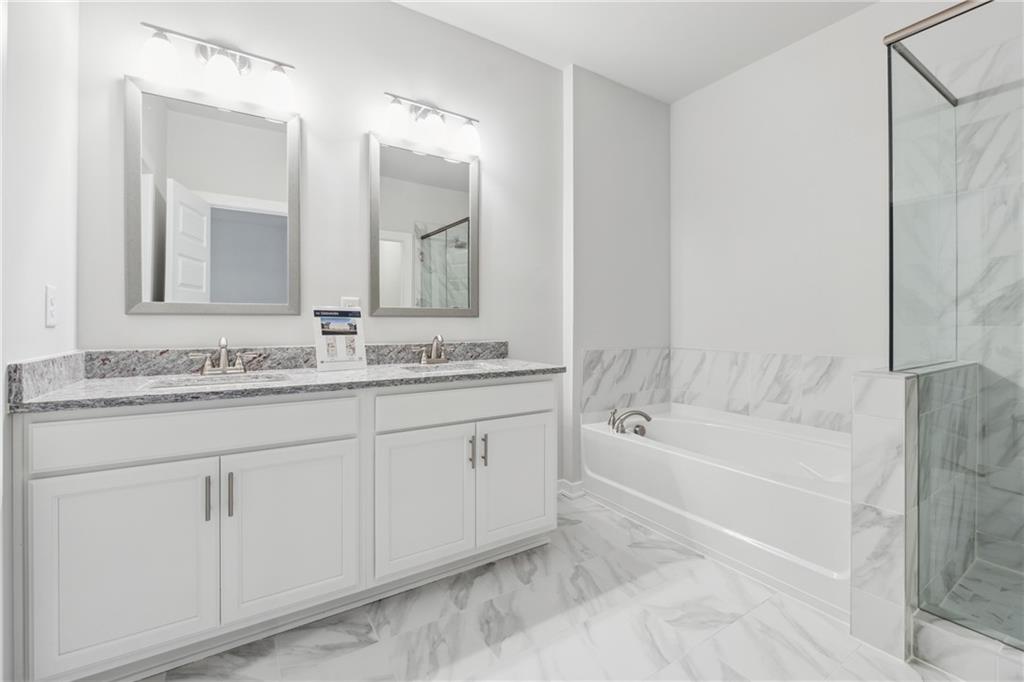 2546 Harbor Ridge Pass, Unit 341 Gainesville, GA 30507 - Photo 13 of 41 a bath room with a sink and a mirror