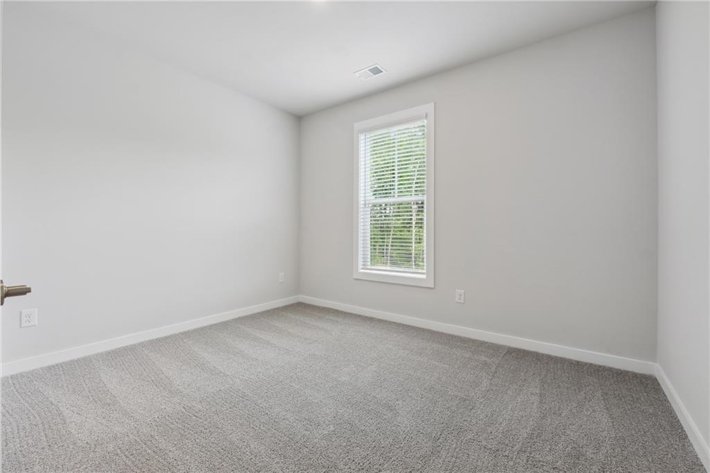 2546 Harbor Ridge Pass, Unit 341 Gainesville, GA 30507 - Photo 16 of 41 an empty room with a window