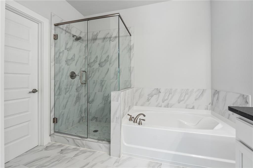 2546 Harbor Ridge Pass, Unit 341 Gainesville, GA 30507 - Photo 24 of 41 a bathroom with a bathtub and shower