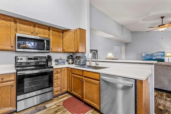 a kitchen with kitchen island a large window in it