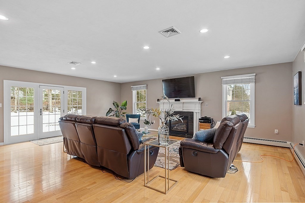 7 Gavin Circle Andover, MA 01810 - Photo 17 of 42 a living room with furniture and a flat screen tv