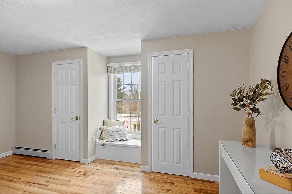 7 Gavin Circle Andover, MA 01810 - Photo 22 of 42 a view of a livingroom with wooden floor and cabinet