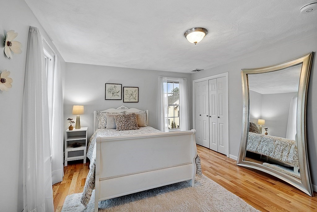 7 Gavin Circle Andover, MA 01810 - Photo 24 of 42 a view of a bedroom with a bed and hallway