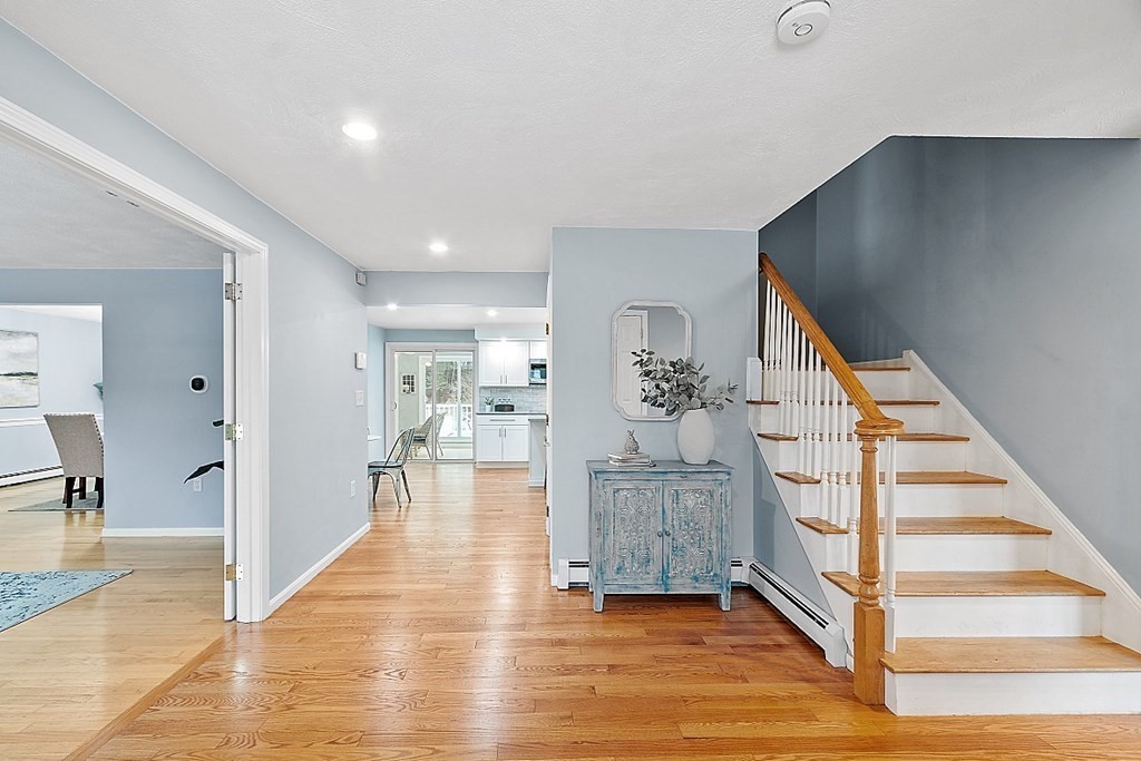 7 Gavin Circle Andover, MA 01810 - Photo 3 of 42 a view of front door with hallway and wooden floor