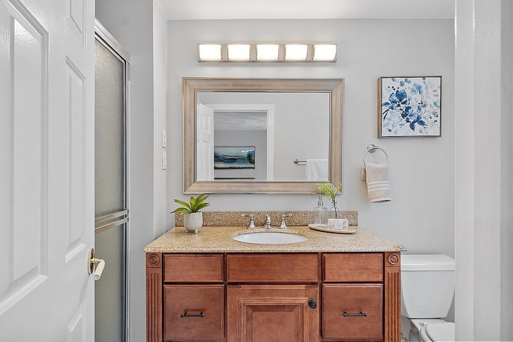 7 Gavin Circle Andover, MA 01810 - Photo 32 of 42 a bathroom with a sink vanity and a mirror