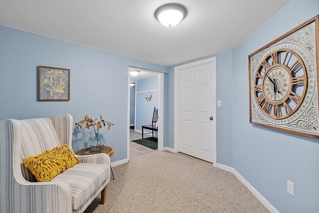 7 Gavin Circle Andover, MA 01810 - Photo 34 of 42 a living room with furniture and a white wall