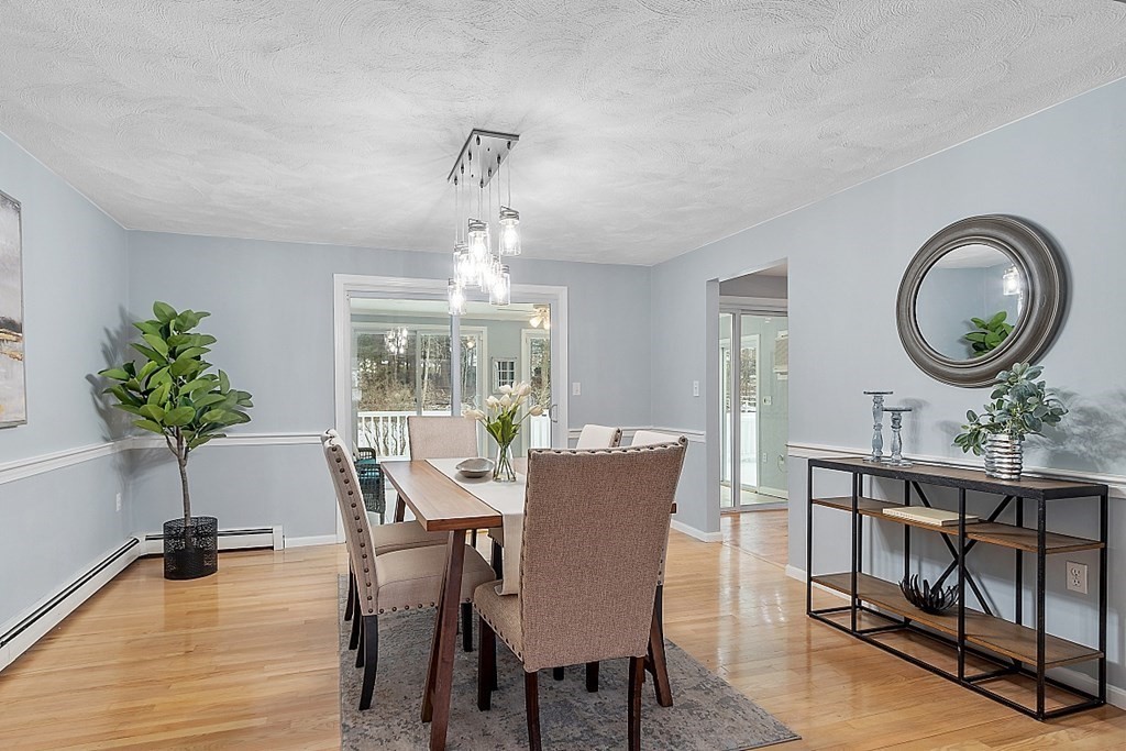 7 Gavin Circle Andover, MA 01810 - Photo 8 of 42 a view of a dining room with furniture window and wooden floor