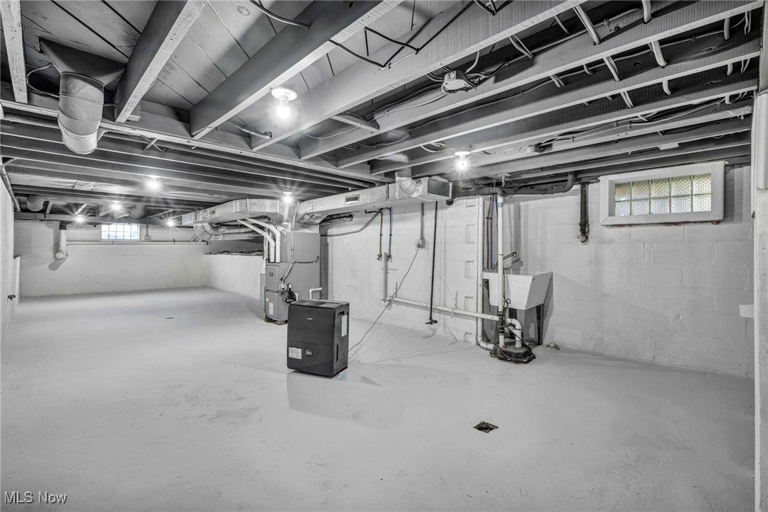 503 Churchill Road Youngstown, OH 44505 - Photo 19 of 32 Basement with heating unit and a sink