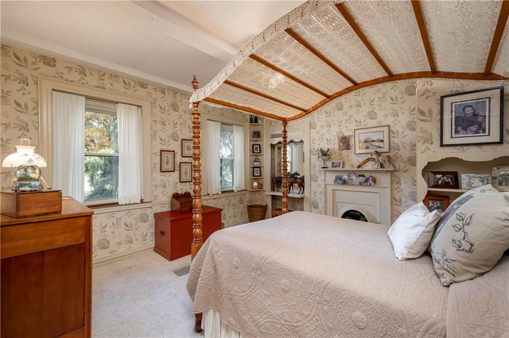 957 Butler Pike Mercer, PA 16137 - Photo 12 of 25 a bedroom with a bed and wooden floor