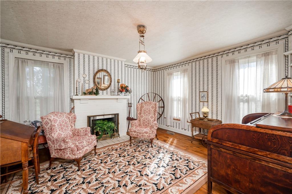 957 Butler Pike Mercer, PA 16137 - Photo 8 of 25 a living room with furniture and a fireplace