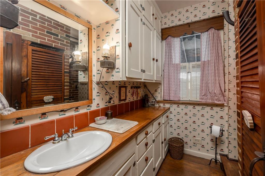 957 Butler Pike Mercer, PA 16137 - Photo 9 of 25 a bathroom with a sink double vanity and a mirror