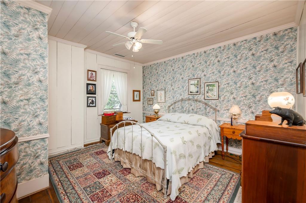 957 Butler Pike Mercer, PA 16137 - Photo 10 of 25 a bedroom with a bed and wooden floor