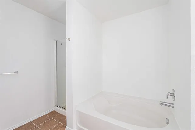 a white bath tub sitting next to a white sink