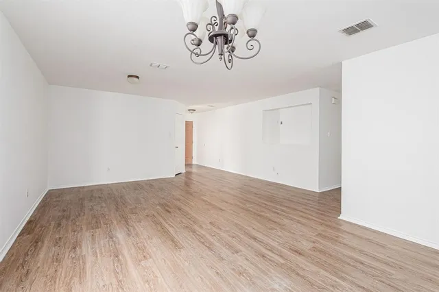 a view of hallway with wooden floor