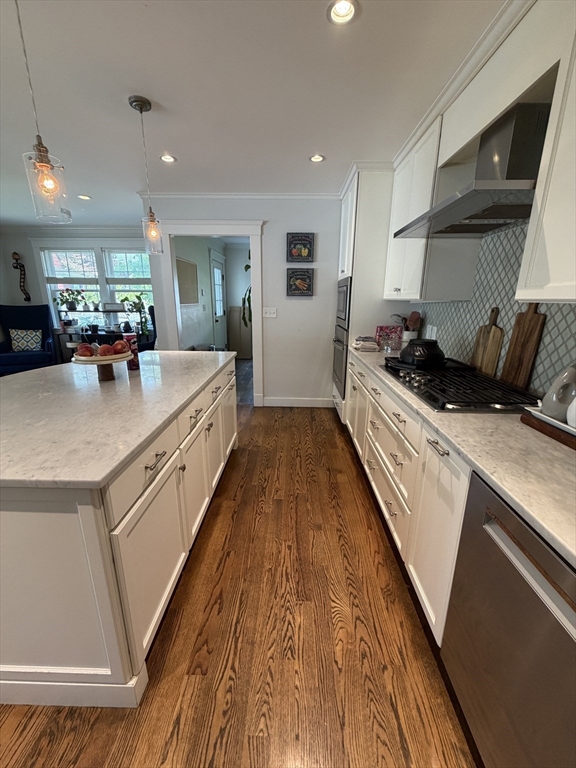 17 Cardinal Street, Unit 17 Winchester, MA 01890 - Photo 10 of 42 a large white kitchen with sink stove and refrigerator