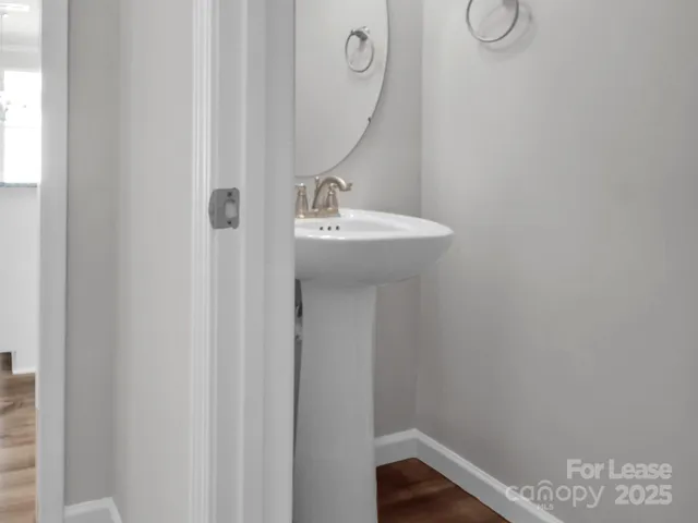 a bathroom with a sink and mirror