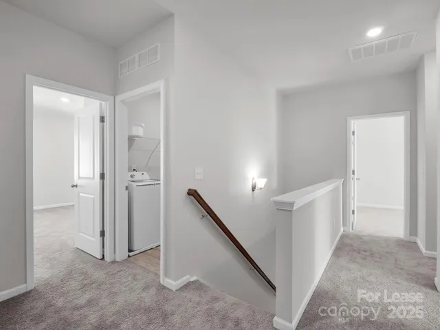 a view of a hallway with closet area